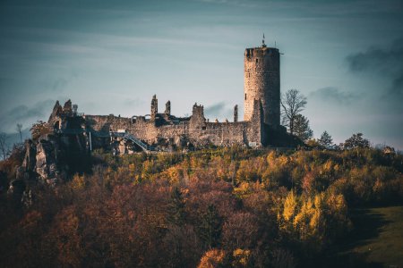 Photo for An old ruined castle on the top of the hill on the sunrise - Royalty Free Image