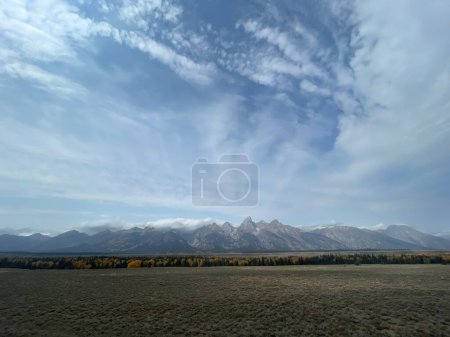 Photo for A scenic view of a mountain range under bright blue sky - Royalty Free Image