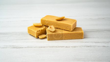 Photo for A closeup of a soft nougat bar made with peanuts and honey to create turron perfection - Royalty Free Image