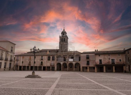 Photo for The sunset at the Plaza Mayor, main square of the medieval town of Medinaceli and the collegiate church in Soria, Spain - Royalty Free Image