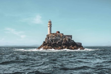 Photo for A scenic view of Fastnet lighthouse located on a rocky island in County Cork, Ireland - Royalty Free Image