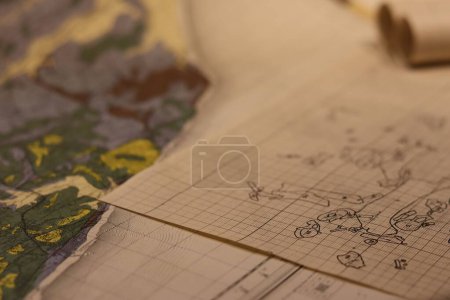 Photo for A closeup of old maps laid together on a table, a cartographic background - Royalty Free Image