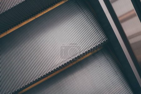 Photo for A closeup top view of an escalator and its metal stairs in detail - Royalty Free Image