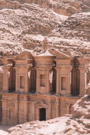 Photo for A vertical shot of Ad Deir Monastery in the historic and archaeological city of Petra, Jordan - Royalty Free Image