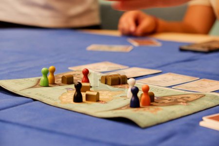 Photo for A closeup of a pirate board game with colorful pawns against the blurry background. - Royalty Free Image