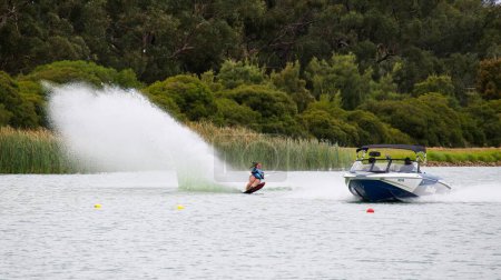 Photo for A Female competitor crossing lake at National Water Ski Championships - Royalty Free Image