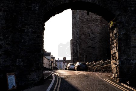 Photo for A road through a tunnel with parked cars near Castell Caernarfon, United Kingdom - Royalty Free Image