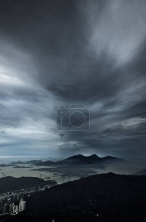 Photo for A beautiful view over the city with the sea in the background under the gloomy stormy sky - Royalty Free Image
