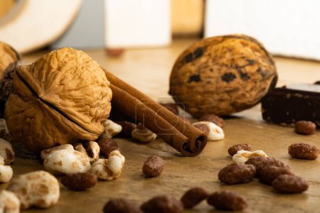 Photo for A closeup shot of walnuts and chocolate spread over the wooden table - Royalty Free Image