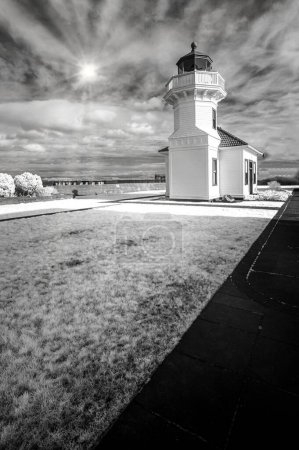 Photo for A vertical grayscale of the Mukilteo Lighthouse with a cloudy sky in the background, United States - Royalty Free Image
