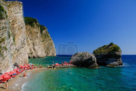 Photo for A crowded beach on Saint Nicholas island in Budva, Montenegro - Royalty Free Image