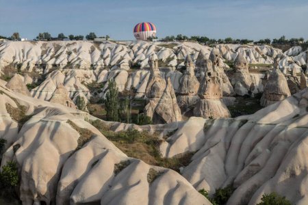 Photo for A beautiful shot of the hot air balloons over a landscape in the Cappadocia area in Turkey - Royalty Free Image