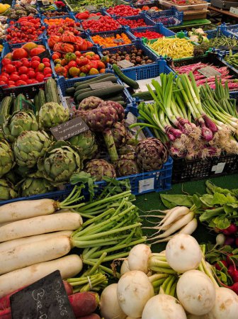 Photo for A vertical shot of fresh vegetables in an open-air market - Royalty Free Image