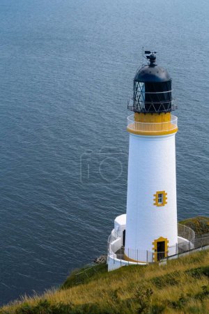 Photo for A vertical shot of Maughold Lighthouse of the Isle of Man - Royalty Free Image