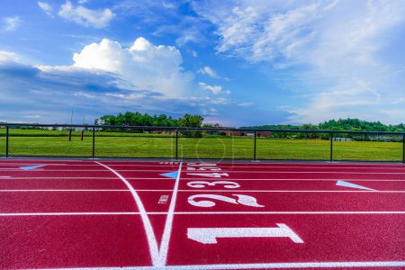Photo for Low perspective image new running track looking across track - Royalty Free Image