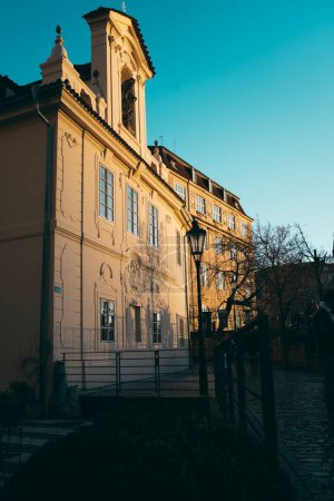 Photo for A scenic shot of old buildings with European architecture with the evening sun shining on the windows - Royalty Free Image