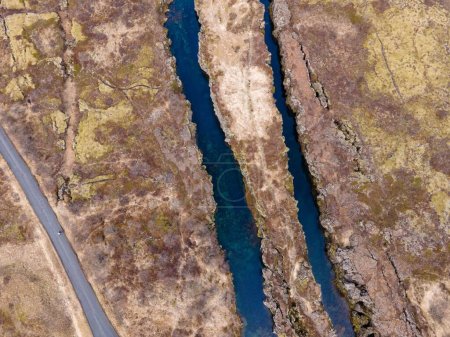 An aerial drone shot of the landscape of Thingvellir fault line in Iceland