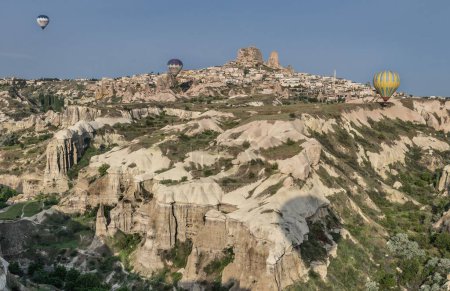 Photo for A beautiful shot of the hot air balloons over a landscape in the Cappadocia area in Turkey - Royalty Free Image