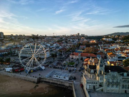Photo for An aerial view of a Ferris wheel in the city on the sunset - Royalty Free Image