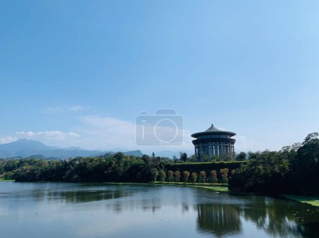 Photo for A distant view of a temple at the coast of an Emei lake in Hsinchu, Taiwan - Royalty Free Image