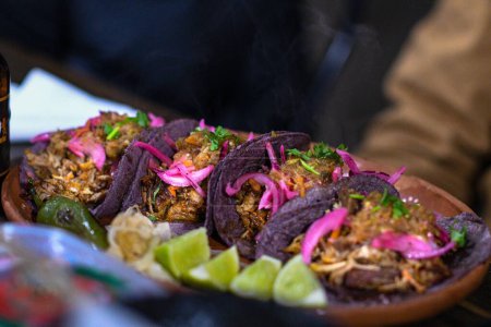 Photo for A selective focus shot of delicious tacos on a plate - Royalty Free Image