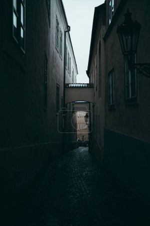 Photo for A vertical shot of a narrow street in the evening - Royalty Free Image