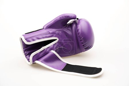 Photo for A single purple boxing glove with an open strap isolated on a white background - Royalty Free Image