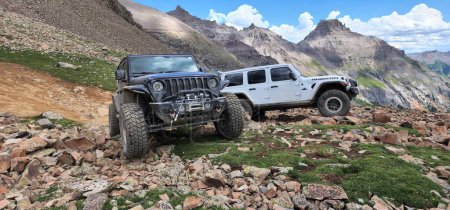 A Jeep Wrangler Unlimited and Jeep JK cars on Yankee Boy Mine mountains Ouray, Colorado
