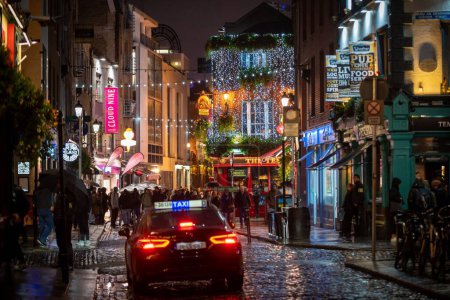 Photo for The Busy Temple Bar Street on a late rainy evening in Dublin - Royalty Free Image
