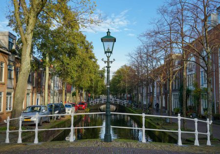 Photo for A street lamp in the middle of a canal bridge in Amsterdam, Delft - Royalty Free Image