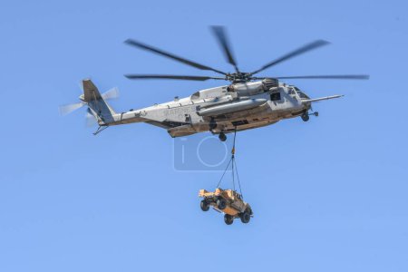 Photo for Military aircraft(Sikorsky CH-53E Super Stallion) transports to the car at the MCAS Miramar Air Show 2022 - Royalty Free Image