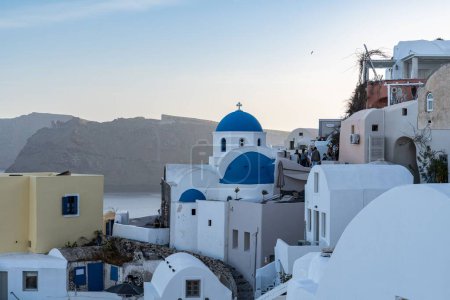 Photo for The Oia Town in Santorini with  traditional Cycladic houses overlooking the Sea, Greece - Royalty Free Image