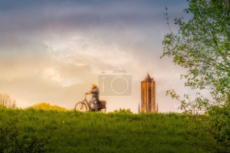 Photo for A scenic view of a person riding his bicycle outdoors during the afternoon - Royalty Free Image
