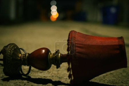 Photo for A closeup of an old red turned lamp against blurred background - Royalty Free Image