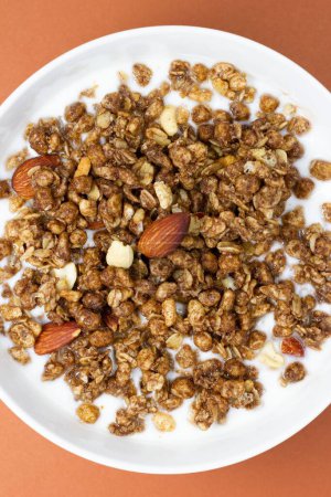 Photo for A closeup of Muesli nuts cereal in yogurt bowl - Royalty Free Image