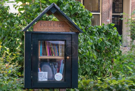 Photo for A small box with books, a free mini-library outside. - Royalty Free Image