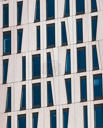 The exterior of a building with abstract asymmetrical windows