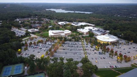 Photo for An aerial view of Bryant University and a parking lot with a lake in the background - Royalty Free Image