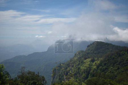 Photo for Cloudy sky over peaceful green mountains - Royalty Free Image