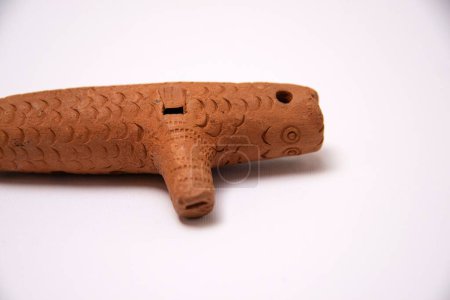 Photo for A closeup of an ocarina old wind musical instrument made of clay on a white background - Royalty Free Image