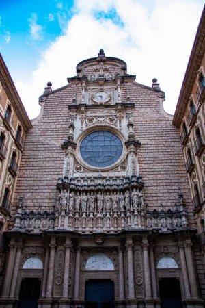 Photo for A vertical shot of the frontal facade of the Monastery of Santa Maria de Montserrat - Royalty Free Image