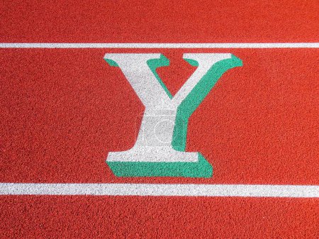 Photo for Two tone white and green letter Y painted on running track. - Royalty Free Image