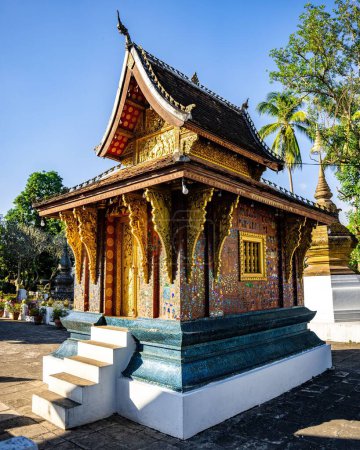 Photo for A vertical shot of the beautiful architecture of Wat Xiengthong temple located in Luang Phrabang, Laos - Royalty Free Image