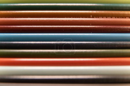 Photo for This is a photo of 12 Prismacolor pencils arranged into a rainbow like formation.  They are lying horizontal in the photo. - Royalty Free Image