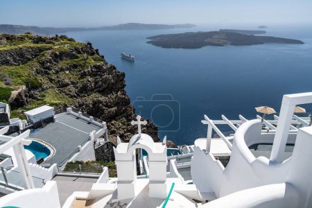 Photo for The typical white washed greek buildings in Santorini overseeing the caldera in Greece - Royalty Free Image