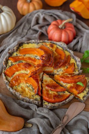 Photo for A vertical high-angle shot of a pumpkin quiche - homemade tasty dinner - Royalty Free Image