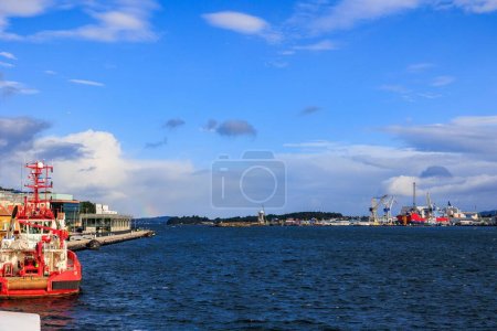 Photo for A beautiful landscape of a seascape with calm waters with a port and construction machinery - Royalty Free Image