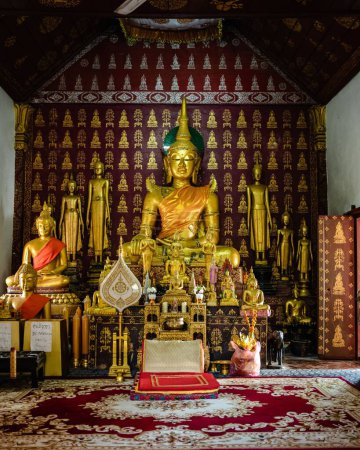 Photo for The Buddha and icons at 16th Century Buddhist Temple, Wat Xieng Thong in Luang Prabang, Laos, SE Asia - Royalty Free Image