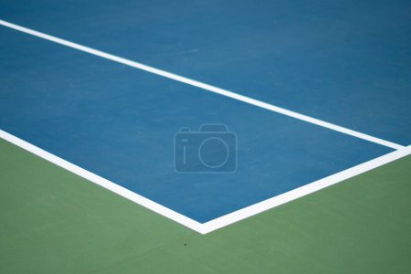 Photo for The left sideline of a blue tennis court with white lines, concept of a tennis match - Royalty Free Image