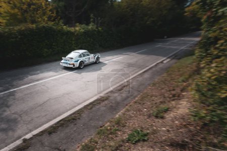 Photo for A white car set up during an uphill speed race of the Italian championship in Pesaro - Royalty Free Image